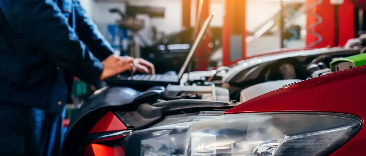 Mechanic in garage ordering parts using Transend shop management system integrations